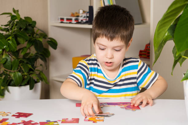 istock A preschooler plays puzzles, puts together a picture 1367806077
