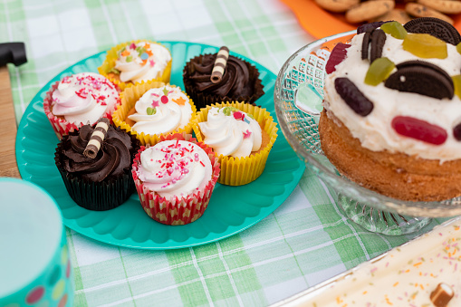 Close-up shot of cupcakes and cakes at a bake sale outdoors in the North East of England.