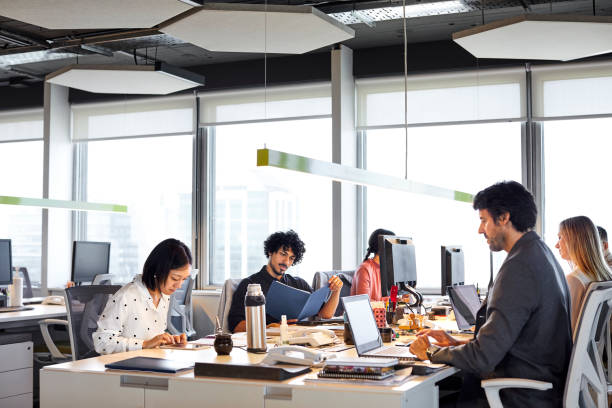 istock Business professionals working in office 1367806202