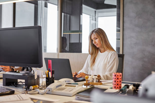 istock Businesswoman working at table in office 1367806204