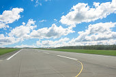Empty runway and cloudy in blue sky on summer.