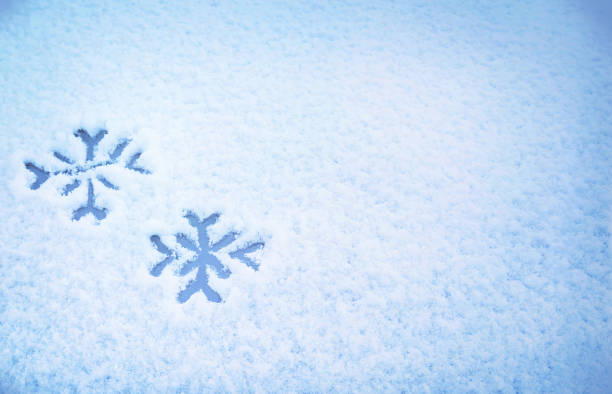 istock Two snowflakes painted on snow on the car. 1367806464