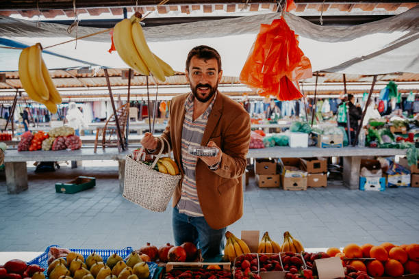 istock Buying some fruits on open market 1367806601