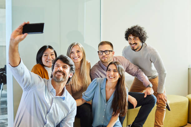 istock Manager taking selfie with coworkers in office 1367806620