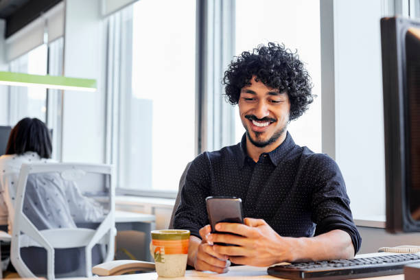 istock Male entrepreneurs using smart phone in office 1367807305