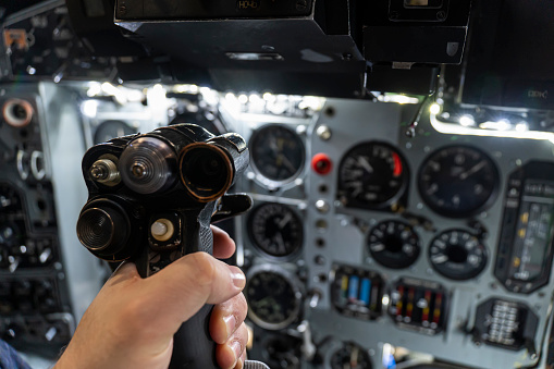 helm of a military helicopter in the pilot's hand. fighter pilot. Inside the attack aircraft.