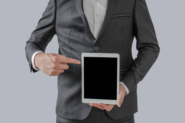 istock Businessman hand holding tablet with blank on screen display 1367808776