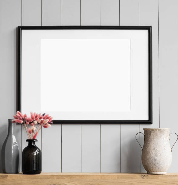istock Artwork mock-up in interior design. Blank white picture frame on a wall 1367809484