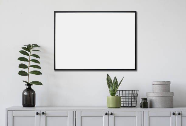 istock Artwork mock-up in interior design. Blank white picture frame on a wall 1367810515