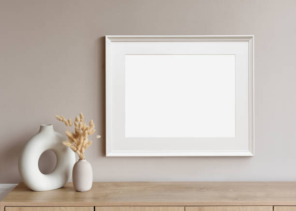 istock Artwork mock-up in interior design. Blank white picture frame on a wall 1367810589