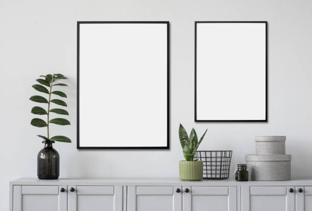 istock Artwork mock-up in interior design. Two blank white picture frames on a wall 1367810661