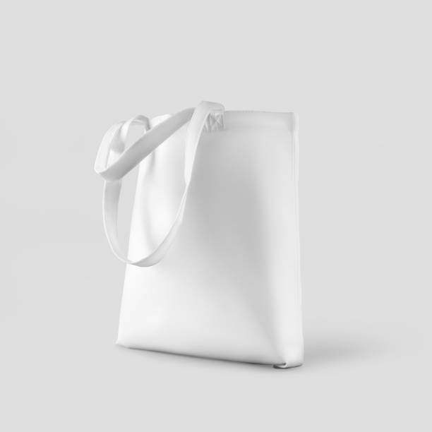 istock White textured totebag mockup with handles down, 3d rendering, isolated on background. 1367810675