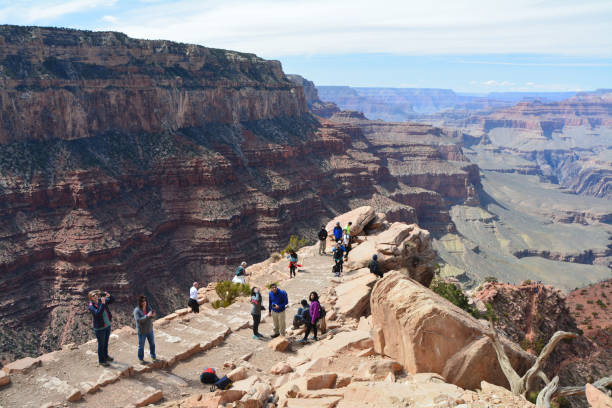 Tourists in Grand Canyon National Park on South Kaibab trail at Ooh Aah Point. Grand Canyon Village, USA - MARCH 25, 2018 : Tourists in Grand Canyon National Park on South Kaibab trail at Ooh Aah Point. Spring time. south kaibab trail stock pictures, royalty-free photos & images