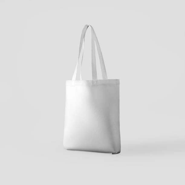 istock White totebag mockup 3d rendering, textured ecobag with handles, isolated on background. 1367811780