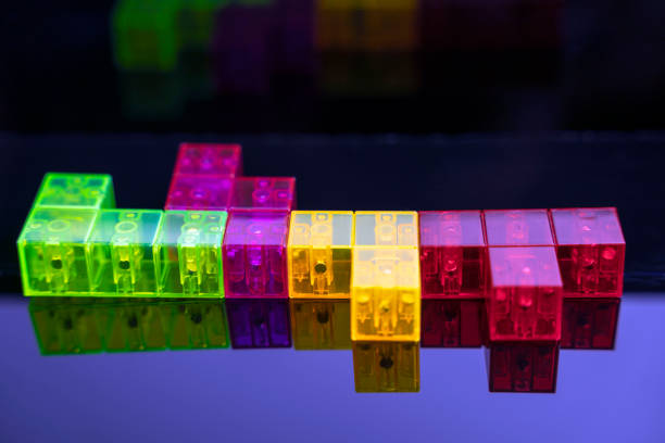 istock three-dimensional colored game figures on glossy black glass, space for copying 1367812065