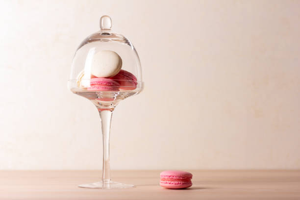 istock Tasty macaroons on cake stand with dome 1367813853