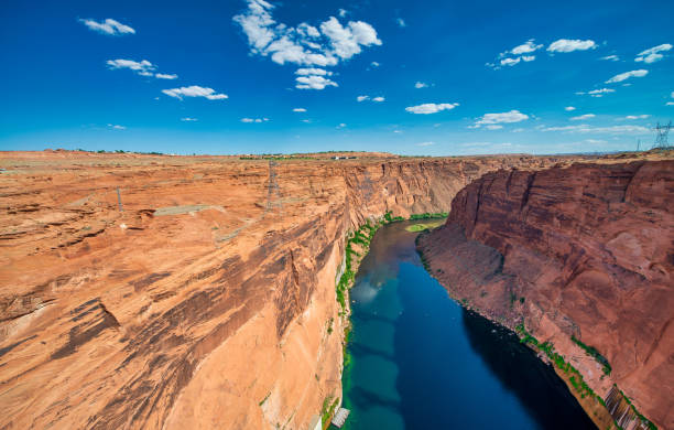 Lake Powell and Glen Canyon Dam in the Desert of Arizona under a blue summer sky, USA Lake Powell and Glen Canyon Dam in the Desert of Arizona under a blue summer sky glen canyon dam stock pictures, royalty-free photos & images