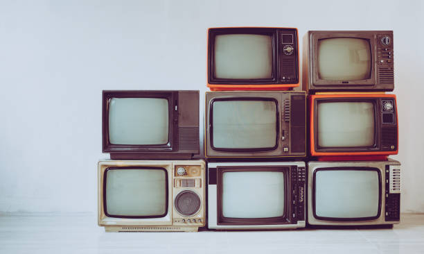 istock Pile of old retro television in room, vintage filter effect 1367821966