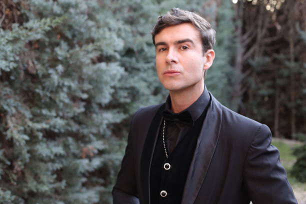 istock Elegant man wearing full black outfit 1367822038