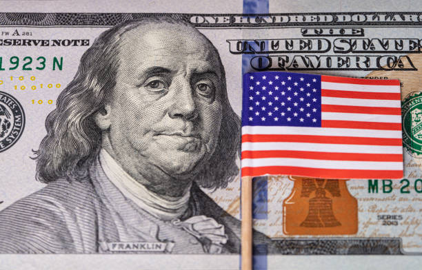 istock U.S. 100 dollar banknote on american flag background 1367824593