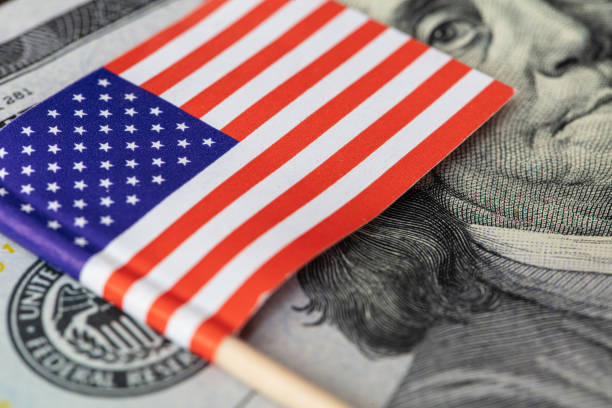 istock U.S. 100 dollar banknote on american flag background 1367824738