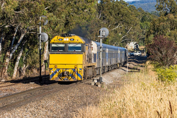 istock Australian Overland Passenger train passing through rural countryside 1367824838
