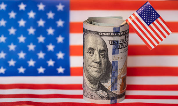 istock U.S. 100 dollar banknote on american flag background 1367824971
