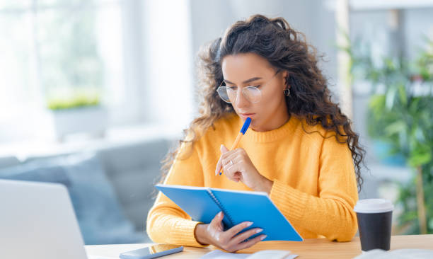 istock woman working on laptop at home. 1367825258