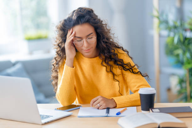 istock woman working on laptop at home. 1367825267