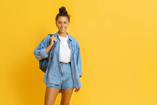 istock young woman on bright color background 1367825275