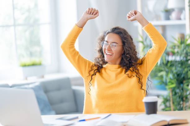 istock woman working on laptop at home. 1367825378