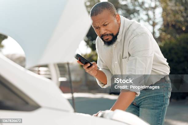 Shot Of A Mature Male Stuck With His Car Outside Stock Photo - Download Image Now - Car, Repairing, Using Phone