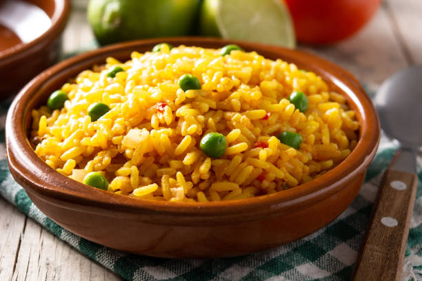 istock Traditional Mexican rice served with green peas in bowl 1367828121