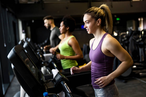 istock People Running on Treadmill in gym 1367830709