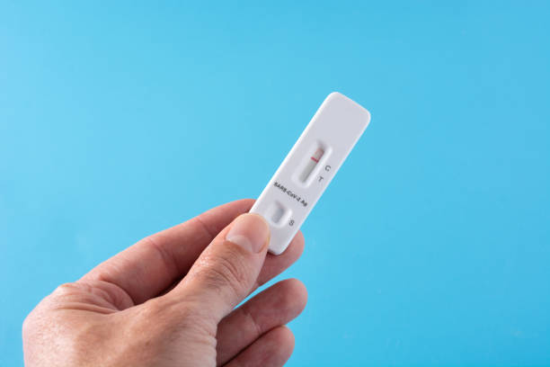 istock Hand showing Covid-19 rapid antigen test 1367830877