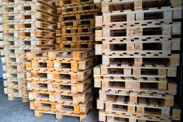istock stacks of pallets in an industrial warehouse 1367833516