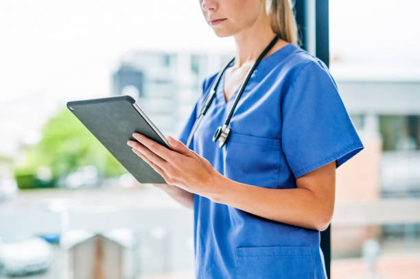 istock Shot of an unrecognizable doctor using a digital tablet at work 1367834796