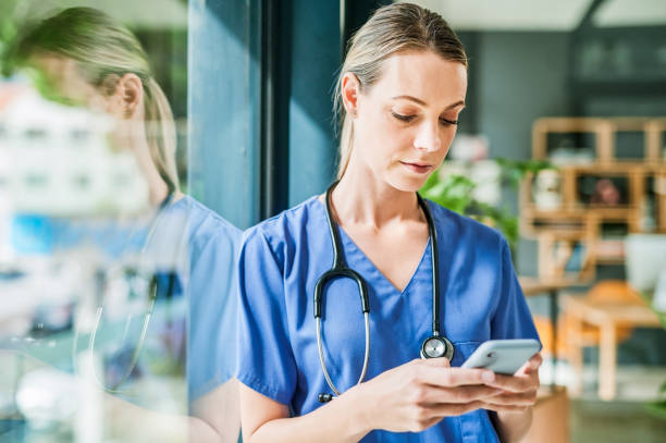 istock Shot of a young female doctor using a phone at work 1367834832