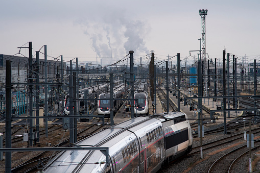 marshalling yard high-speed trains and factory chimneys