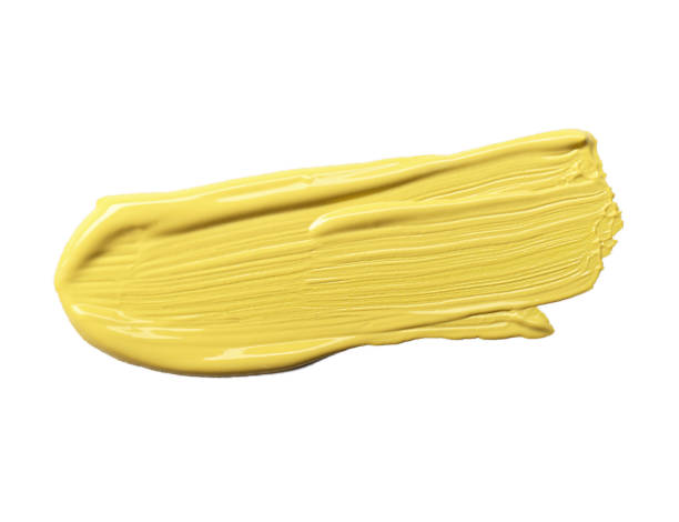 istock Stroke of yellow color correcting concealer isolated on white 1367837790