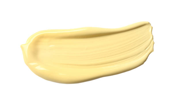 istock Stroke of yellow color correcting concealer isolated on white 1367838033