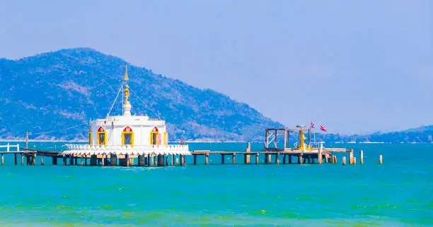 Thai temple in the turquoise water and tropical paradise of Koh Phayam Ranong Thailand.
