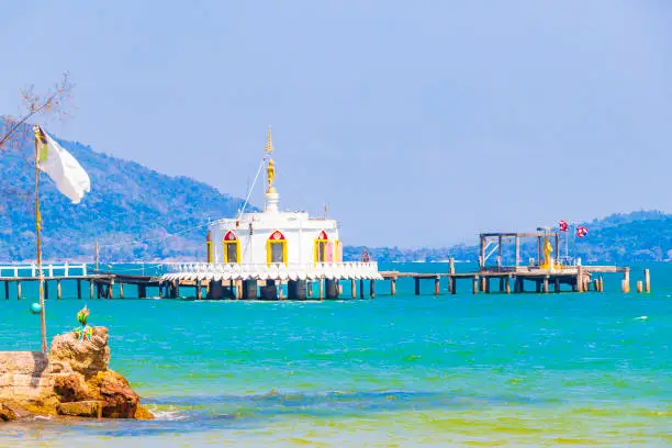 Thai temple in the turquoise water and tropical paradise of Koh Phayam Ranong Thailand.