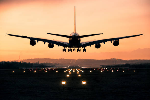 Landing airplane stock photo