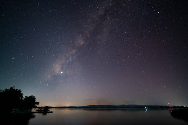 istock Night shot milky way over landscape water 1367840178