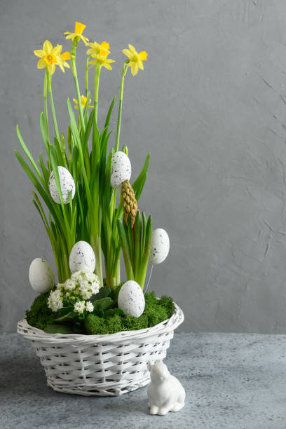 istock Easter handmade flower composition with blossom daffodil. 1367841561