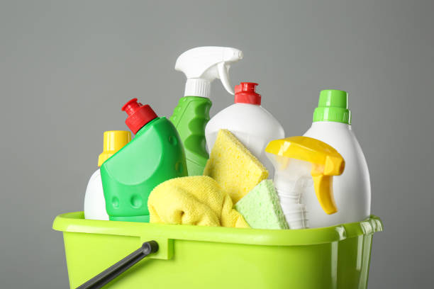 istock Bucket with cleaning products and tools on grey background, closeup 1367841568