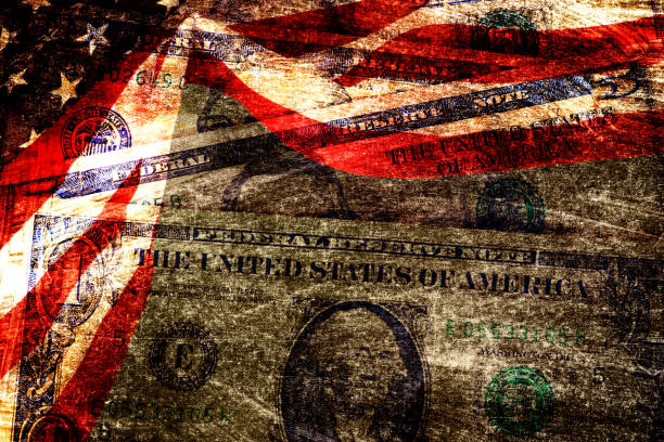 istock Dollar banknotes and American flag 1367842655