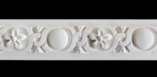 istock A fragment of a white plaster ceiling molding with an ornament. 1367843961