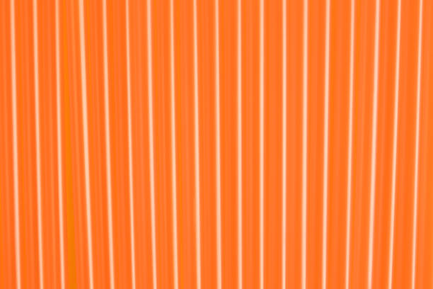 istock Many orange plastic drinking straws as background, closeup 1367844093